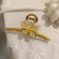 Close-up of golden metal butterfly hair claw clip with yellow resin and crystal details - Apricot Yellow Enamel Butterfly Clip