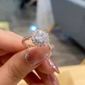 Close-up of sunflower shaped silver ring with sparkling round cut diamonds on a finger - TJZ180-Sunflower Style