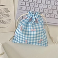 Detailed view of blue checkered drawstring pouch with pink bow prints and cotton ropes - Blue Gingham Bow (Small)