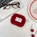 Detailed view of a small red plush square coin purse pouch on a white desk surface - Plush Style / Christmas Red Card Pouch