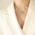 Collana minimalista con perle e sfere d'argento e un ciondolo a cuore lucido - 40+5cm / Argento