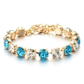 Elegant gold plated bracelet with alternating blue and clear round cut crystals - Alternating Style Bracelet / Blue/White/Gold (SL180)