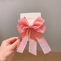 Delicate pink silk-texture bow hair clip for girls with bead edge trim on white card - Deep Pink