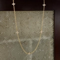 Detailed view of the gold chain necklace featuring five sparkling clover leaf pendants - Clover Necklace / Gold White