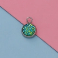 Macro shot of 12mm stainless steel pendant base with sparkling green and blue resin inlay - Green Blue Glitter Style (2)