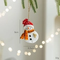 Festive resin snowman ornament with red hat and striped scarf, size 9cm x 6.5cm - Snowman With Bell