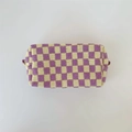 Detailed knit texture of checkerboard cosmetic bag with yellow and purple woven squares - Purple and Yellow Checkerboard