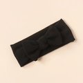 Detail shot of a black ribbed knit bow headband for infants on a neutral background - Black