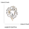 Golden alloy rhinestone brooch with clear crystals, 5.4cm wide and 6.8cm high - Gold