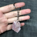 Pink raw crystal stone keychain with silver metal ring held in hand for bag decor - Pink Opal