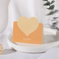 Minimalist heart-shaped greeting card in orange and yellow with Best Wishes text - Orange