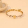 Golden stainless steel bracelet featuring zircon stones and a coin pendant charm - Gold Coin Relief Style (B565-2#)