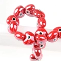 Polished red heart-shaped evil eye ceramic beads for DIY handmade jewelry crafting - 13x14mm / Red