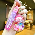 Close-up of a cartoon pig keychain with colorful beads in a liquid sphere and a pink strap - Gradient Rope [colorful] Glow-in-the-dark Pvc Peach Pig