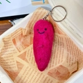 Handmade pink wool felt sweet potato keychain with smiling embroidery detail - Purple Sweet Potato