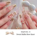 Golden ballet bowknot nail charms with white pearls, style SQ036-3 for sweet manicures - Gold Ballet Streamer