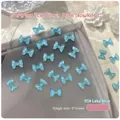 Lake blue translucent resin mini bow charms for nail art and DIY crafts 50pcs - 50 Pcs/Pack / Lake Blue