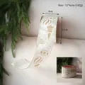 Détail du ruban de Noël en velours crème de 6cm avec ornements et étoiles dorés - Ruban Polyester à Boule Spéciale Champagne 6.3cm*10 Yards