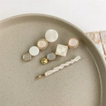 Detailed view of a 3-piece set featuring pearl and resin hair clips on a ceramic plate - Style 4 (3-Piece Set/White-Beige-Gold)