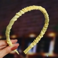 Detailed view of yellow pleated fabric headband with soft texture and stylish folds - Yellow (Cloth Pleated)