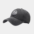 Detail view of washed cotton baseball cap with white round energy logo and six-panel stitch - Adjustable / Black