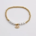 Pulsera de cuentas doradas con perlas y colgante de ojo turco con circonitas blancas - Pestañas Disco Ojo del Diablo