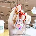 Cartoon rabbit cat paw liquid quicksand keychain with red bell and metal clasp detail - Red Cinnamoroll Milk Bean
