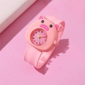 Pink cartoon pig quartz watch for kids with soft silicone strap on pastel background - Pig