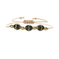 Detailed close-up of handmade woven rope bracelet with geometric ceramic rhombus beads - Bronze Bead & Dark Green