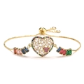 Adjustable gold heart bracelet with colorful micro-pave cubic zirconia on white background - Heart with Pink Zircon Accent