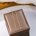 Elegant gold double chain tassel earrings displayed on a dark jewelry gift box - Double Chain Tassel Style (E3556-1)