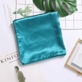 Peacock blue satin silk square scarf 90cm laid flat on a white minimalist background - Teal