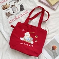 Detail showing red canvas tote bag with cartoon dog embroidery and Happy Day text - Basket Dog (Red)