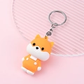 Cute cartoon dog keychain in orange and white finish with a durable metal ring - Shiba Inu
