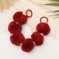 Detailed view of red plush pompom beads and pearls on a stylish mobile wrist strap - Wine Red Style (K2494)