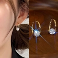Detail of gold U-shaped earrings featuring round cubic zirconia in a split-view display - U-Shaped Round Zirconia Design (E1677 Gold) / 925 Silver Needle / Gold