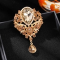 Luxurious champagne crystal brooch with waterdrop pendant in elegant gold-plated finish - Gold