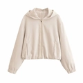 Detail of beige zip-up hooded jacket showing textured fabric and elasticated bottom hem - XS / Cream White Top
