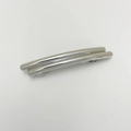 Macro detail of glossy silver long spring hair clip with irregular punk metal texture - Cylindrical Silver