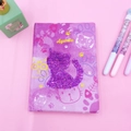 Detail of purple sequin cat diary with Agenda lettering and cute paw print patterns - Cat