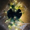 Christmas garland with large dark green velvet bow, silver baubles, and warm LED lights - Luminous Green