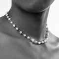 Retro hip-hop cross necklace with imitation pearls and rhinestones on a male model - A2-15 (6mm Rhinestone Ball Pearl)