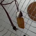 Detail of adjustable Bohemian necklace featuring geometric amber and brown pendants - Trapezoid Brown & Yellow Combination