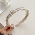 Elegant beige pleated headband with a pearl bow accent and shimmering rhinestone chain - 220539 Beige