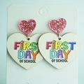 Detailed view of Back to School earrings featuring a pink glitter heart and First Day text - First Day Of School Heart