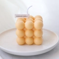 Handmade bubble cube scented candle in creamy yellow color on a minimalist ceramic tray - Cheese Yellow - Orange Blossom