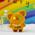 Gros plan détaillé d'un mignon porte-clés ours en peluche orange avec des yeux en étoile - 12cm / Brun Foncé