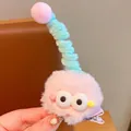 Pink plush hair clip with cartoon eyes and spiral detail for girls, 5cm diameter - Pink