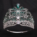 Macro detail of silver crown with emerald teardrop crystals and baroque rhinestones - Silver / Green Zirconia