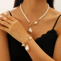 Elegant Baroque pearl necklace and bracelet set with gold OT clasp on a female model - Gold Baroque Pearl 2-Piece Set (Bracelet+Necklace)